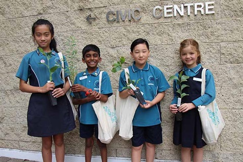 Junior Advisory Group Members Holding Seedlings