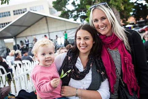 Two young women with a baby