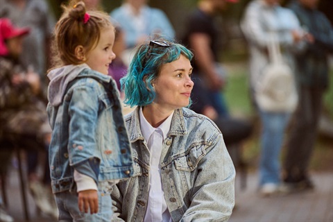Young woman in denim out on a relaxed outing with her child