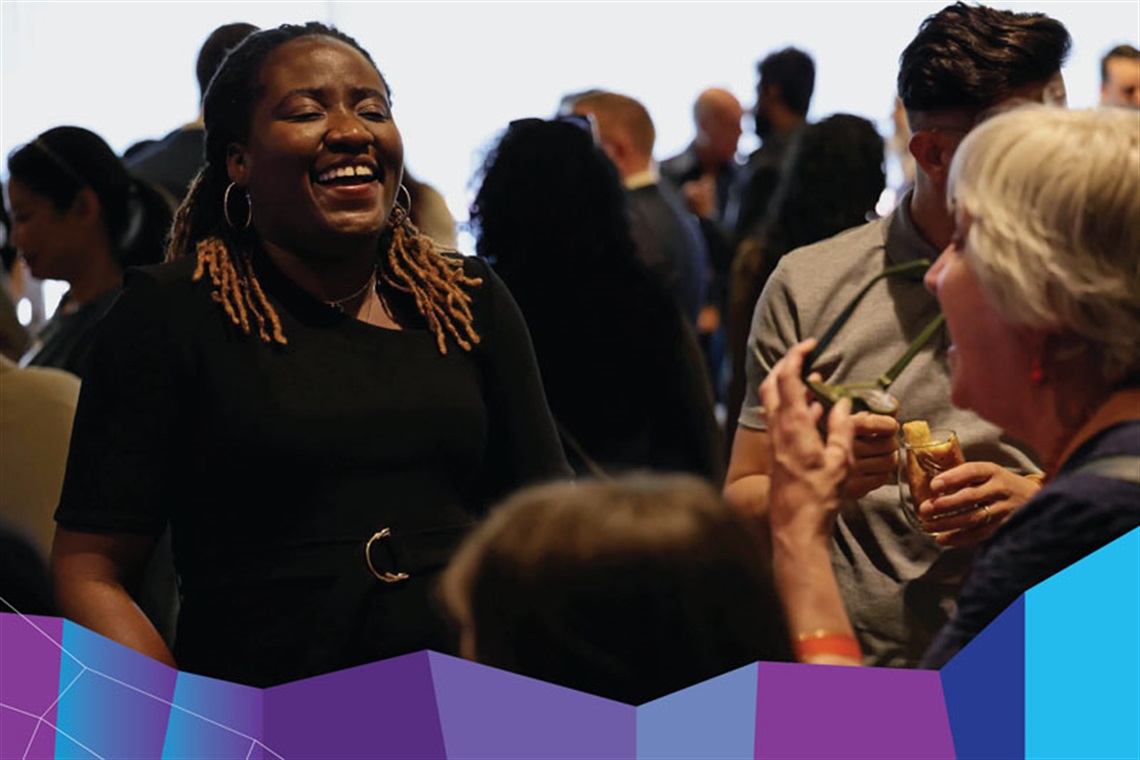 Women laughing at a networking event 
