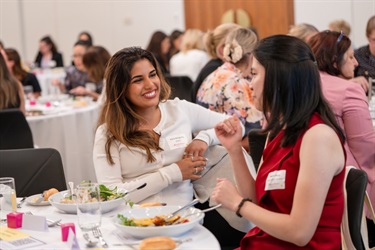Attendees sharing ideas and making connections at a Monash Women's Business Network event.