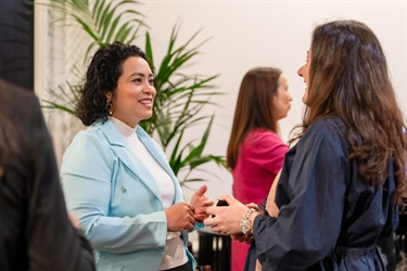Attendees networking and connecting before a Monash Women's Business Network event.