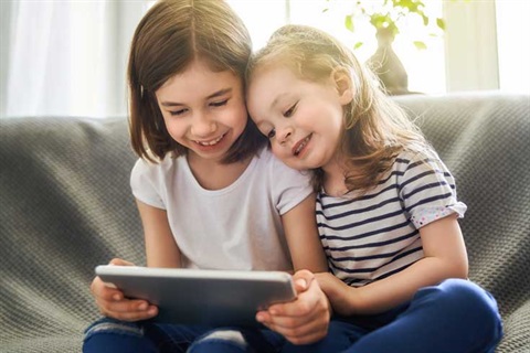 Children playing with a tablet