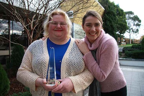 Trudy Ryall holding award