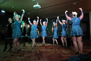 A group of Irish and Highland dancers in full regalia.
