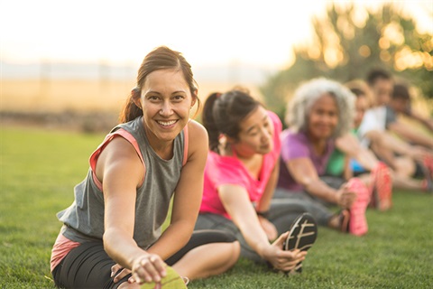 Women Exercising In A Park