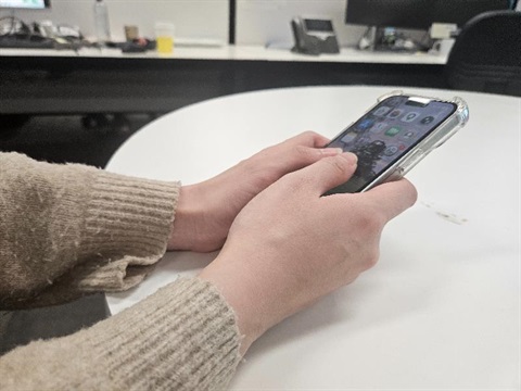 hands holding a mobile phone