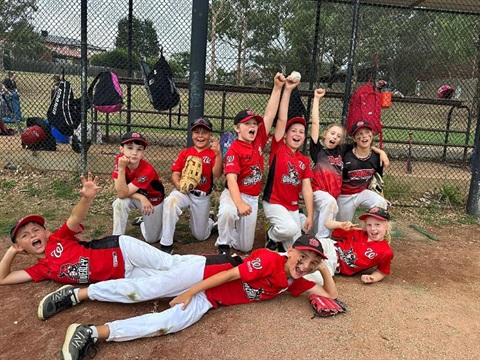 Junior players at Waverley Baseball Club celebrate