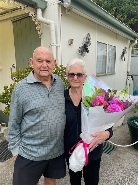 Kevin Deaville and Fran Pask with flowers on 60th wedding anniversary