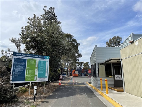Entryway to Monash Recycling and Waste Centre with a big price board on the left